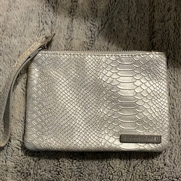 Rodan + Fields Handbags - Rodan + Fields Silver‎ Cosmetic Bag